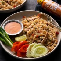 Thai Fried Rice  · Thai style stir-fried jasmine rice with egg, broccoli, onions, snow peas and carrots.