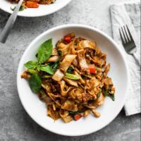 Drunken Noodles  · Stir-fried flat rice noodles in spicy chili paste. Served with egg, onions, bell peppers, to...