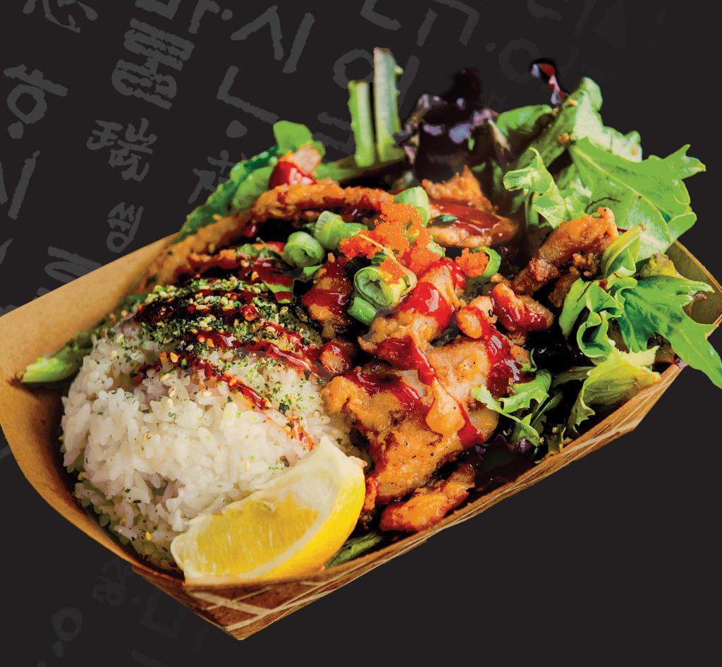 Chicken Bowl · Furikake seasoned white rice and mixed greens, with Korean BBQ topped with spicy gochujang sauce, green onions, sesame seeds, and a lemon wedge.