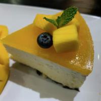 Japanese Mango Cheesecake · A slice of Japanese mango cheesecake