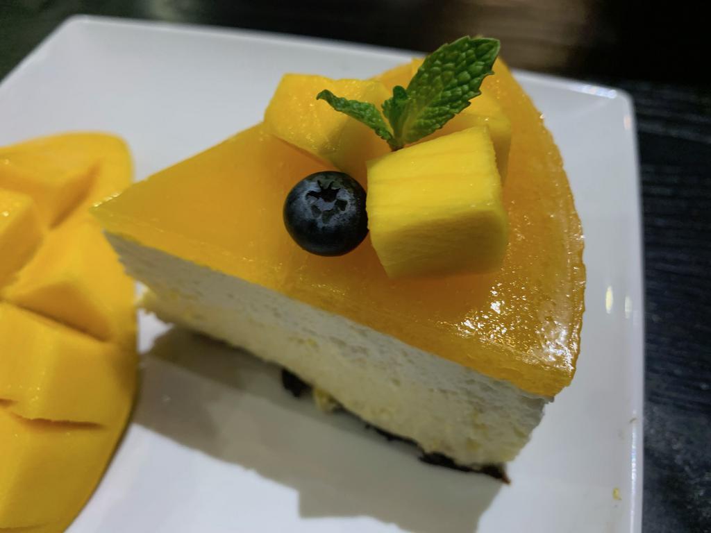 Japanese Mango Cheesecake · A slice of Japanese mango cheesecake