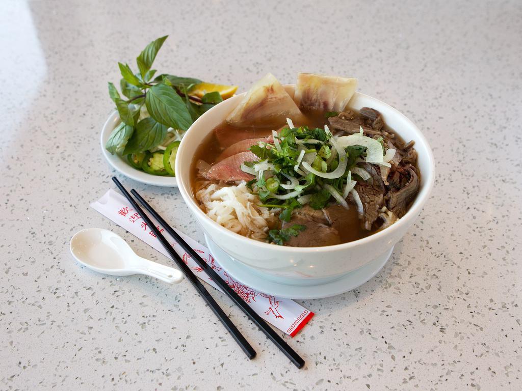 1. House Special Pho · Rice noodles with rare sliced eye round steak, well-done briskets and flanks, tendons and tripe in beef stock.