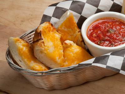 3 Cheese Bread · Giant french bread with 3 cheeses, a touch of garlic and dipping sauce.