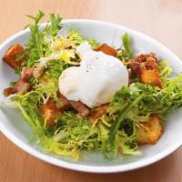 Salade Lyonnaise · Frissee, soft poached egg, bacon lardon and rustic crouton.