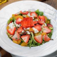 Strawberry Mandarian Salad · Strawberry, feta cheese, walnuts, mandarin orange and mixed greens with raspberry vinaigrette.