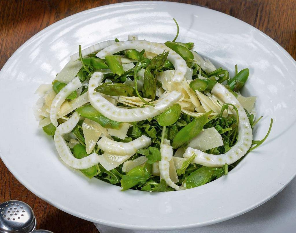 Arugula Salad · Arugula, shaved fennel, shaved Parmesan and asparagus with a lemon vinaigrette dressing.