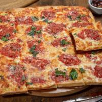 Grandma Thin Crust Pan Pizza · Layered with mozzarella, spotted with flavorful herbs and plum tomato sauce.
