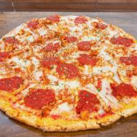 Chicken Parmigiana Pizza · Topped with chicken cutlet, tomato sauce and mozzarella.