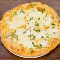 Quattro Formaggio Pizza · Fresh mozzarella, Romano, riccota and mozzarella cheese with fresh basil.