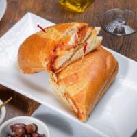 Chicken Parmigiana Hero · A long sandwich on a roll. 