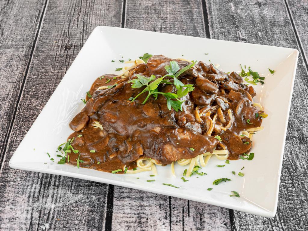 Veal Marsala · Tender veal in a classic Marsala wine sauce with fresh mushrooms and shallots.