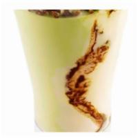 Coppa Pistachio · Custard gelato swirled with chocolate and pistachio gelato topped with praline pistachios.