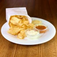 Crisps and Dips · Potato crisps served with curry ketchup, dill dip and creamy dijon aioli.