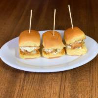 Crispy Chicken Sliders · Battered and fried chicken tenders topped with house made slaw and pickle slices. served on ...
