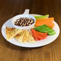 Hummus · creamy hummus drizzled with a balsamic reduction & served with grilled garlic naan bread & v...
