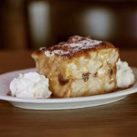 Highland Bread Pudding · Our homemade bread pudding with raisins & custard, served warm with rum butter sauce and whi...