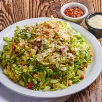 Chopped Salad · Romaine lettuce, red peppers, artichokes, salami, provolone, green olives, garbanzo beans, P...