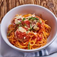 Spaghetti & Meatballs · Three giant meatballs over a generous plate of spaghetti with marinara and Parmesan.