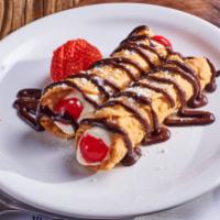 Cannoli · Tube-shaped pastry with a creamy citrus-ricotta filling