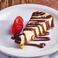 Vanilla Cheesecake · Creamy filling with cream cheese, rich ricotta, sour cream & vanilla bean over a graham crac...
