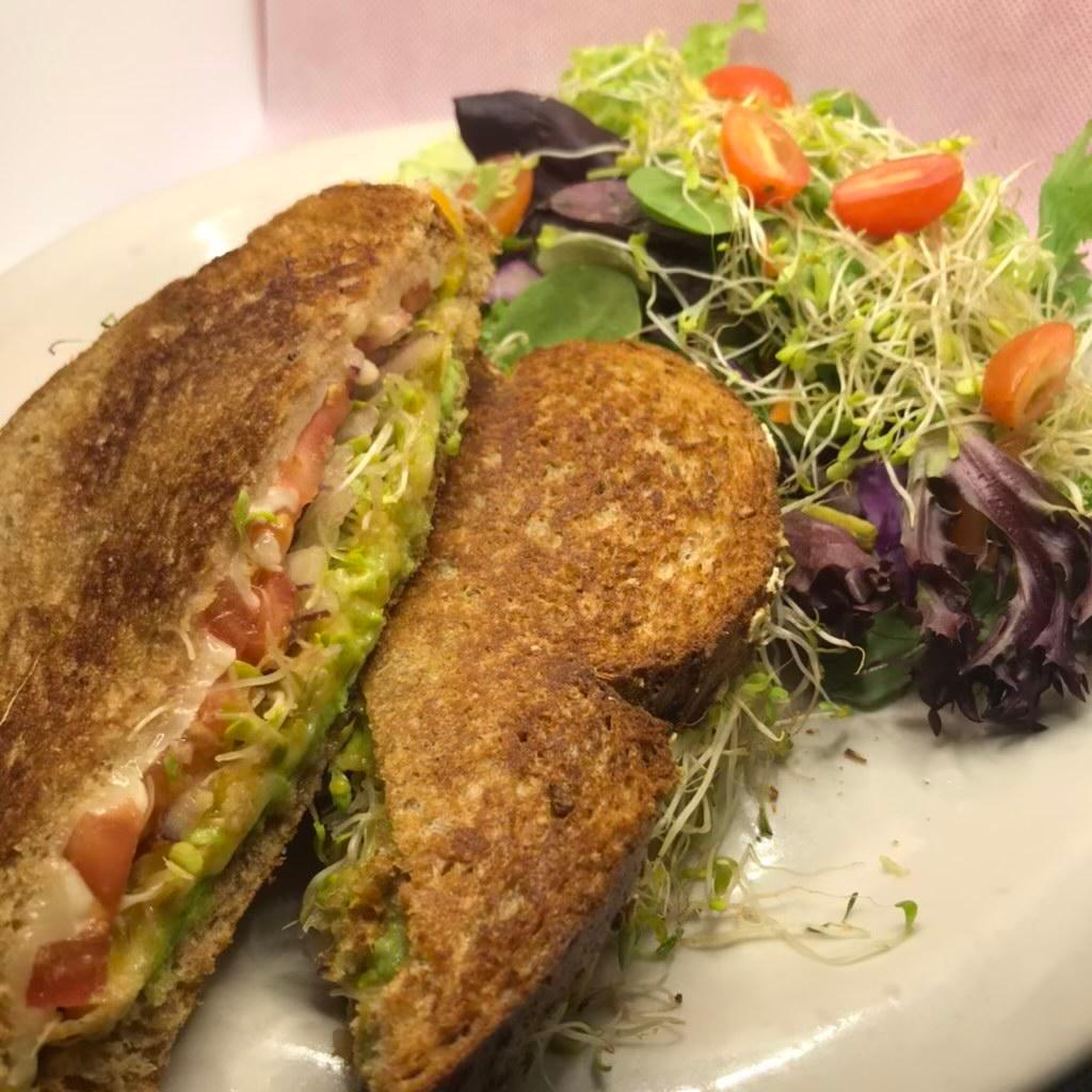Fairfax Sandwich · A grilled veggie sandwich! Avocado, sprouts, tomato and red onion grilled between Jack and cheddar cheese on Bordenaves wheat bread.