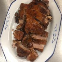 Roast Duck (Bone-In) · Crispy bone-in roasted duck served with a house special plum sauce.