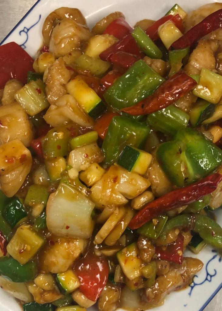Kung Pao Seafood · Stir fried seafood with bell pepper, onion, zucchini, water chestnut, peanut in a garlic brown sauce. Hot and spicy.