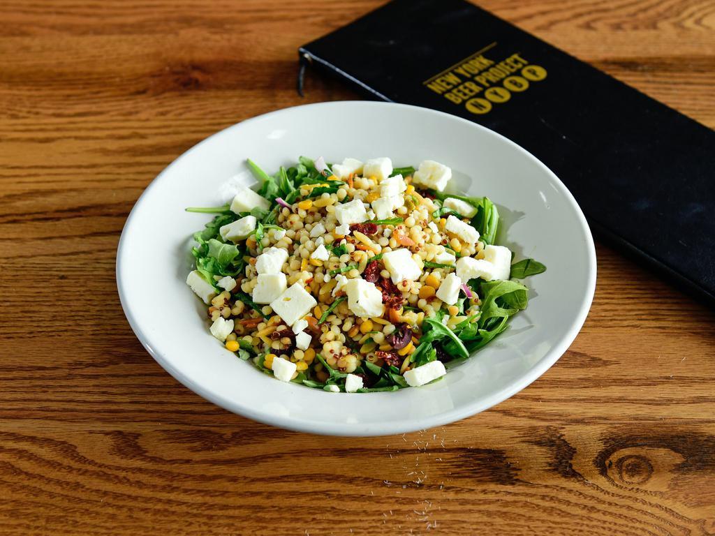 Mediterranean Grain Bowl  · Delicious ancient grain blend of quinoa and couscous mixed with spinach, arugula, feta cheese, sundried
tomatoes, kalamata olives, red onion, basil, and mint tossed in a house-made lemon vinaigrette.