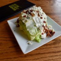 The NYBP Wedge · iceberg lettuce wedge topped with blue cheese dressing, crumbled gorgonzola
and applewood sm...