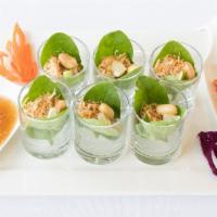 A3. Miang Kham · Roasted coconut, dried shrimp, roasted peanut, red onion, ginger, lime and chili wrapped in ...