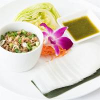 A5. Are Wrapped · Bite-sized Thai wrap platter with lettuce, minced chicken, a mild basil sauce and steamed wi...
