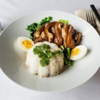 R2. Khao Ka Moo · Slow cooked ham hock in 5 spices, served with steamed Chinese broccoli and hard boiled egg.