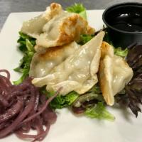 Pot Stickers · Chicken, Lemongrass, Soy Ginger Dipping Sauce, Pickled Red Onion 