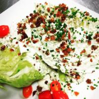 Wedge (GF) · Iceberg Lettuce, Tomatoes, Bacon, House Made Blue Cheese Dressing