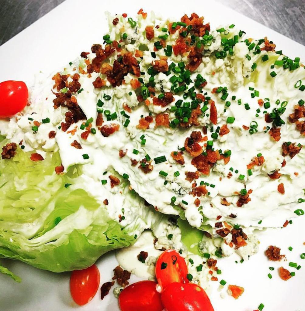 Wedge (GF) · Iceberg Lettuce, Tomatoes, Bacon, House Made Blue Cheese Dressing