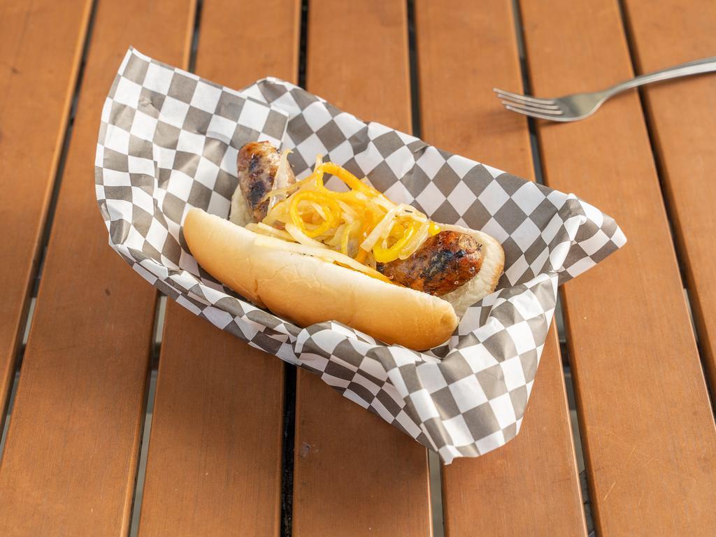 Montego Bay Jerk Chicken Sausage · Grilled chicken sausage seasoned with FiMi Kingston spices on a bun with sauteed onions, peppers.