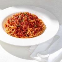 Tomato Basil Spaghettini · With sautéed garlic and fresh basil.  
