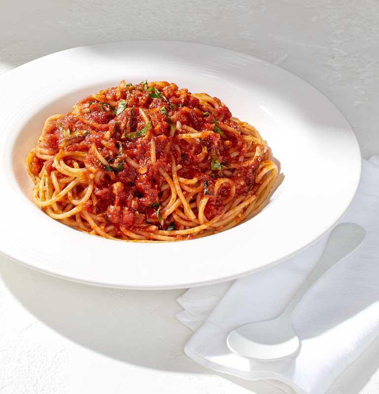 Tomato Basil Spaghettini · With sautéed garlic and fresh basil.  
