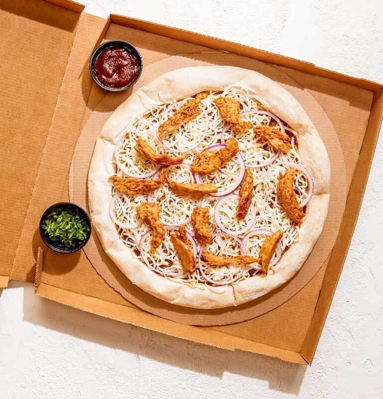 Take and Bake Plant-Based BBQ Chicken Pizza · READY TO BAKE - Our iconic pizza, prepared with plant-based chicken. Vegetarian. 
