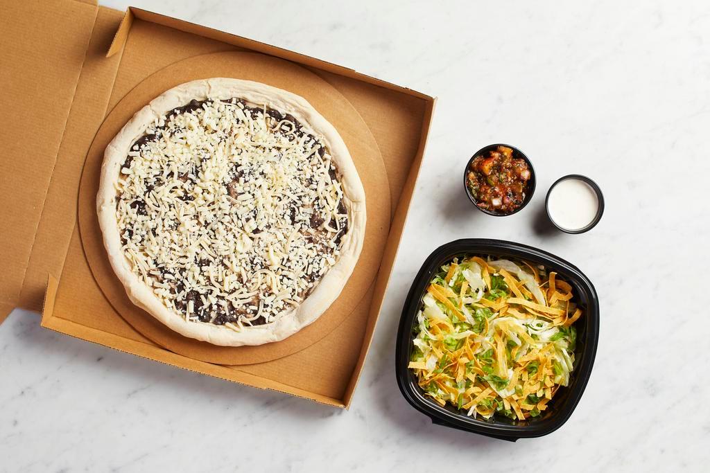 Take and Bake Tostada Pizza  · READY TO BAKE - Crisp lettuce, tortilla strips and house-made herb ranch top this hearth-baked crust with layers of black beans and Monterey Jack. Served with flame-roasted salsa. Also available with carne asada. Vegetarian.
