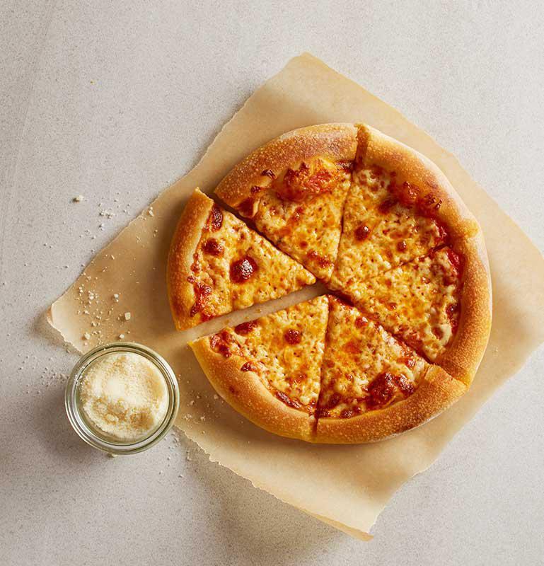 Kid's Traditional Cheese Pizza · Tomato sauce and mozzarella. Includes choice of a fountain beverage, lemonade, apple juice, milk or chocolate milk. Vegetarian.