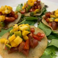 Hawaiian Crunch Tuna · Diced tomato, mango, avocado with Hawaiian sauce marinade tuna on crispy shells.(4pcs)