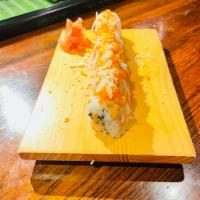 Texan Roll · Spicy crabmeat, avocado inside, topped with crab stick, tempura crumbles, spicy mayo, and ma...