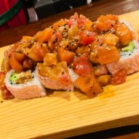 Sunshine Roll · Crabmeat, avocado inside, wrapped in soy paper, topped with spicy mixed tuna, salmon, and wh...