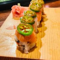 Bellagio Roll · Spicy tuna, avocado inside, topped with salmon, yellowtail, jalapeno and ponzu sauce. Spicy.