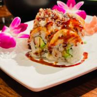Salmon Baked Roll · Shrimp tempura, avocado, crab stick inside, topped with salmon, eel sauce and tempura crumbl...