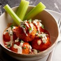 Buffalo Chicken Meatballs · Chicken meatballs tossed in Frank’s Red Hot sauce and served with bleu cheese, carrots, and ...
