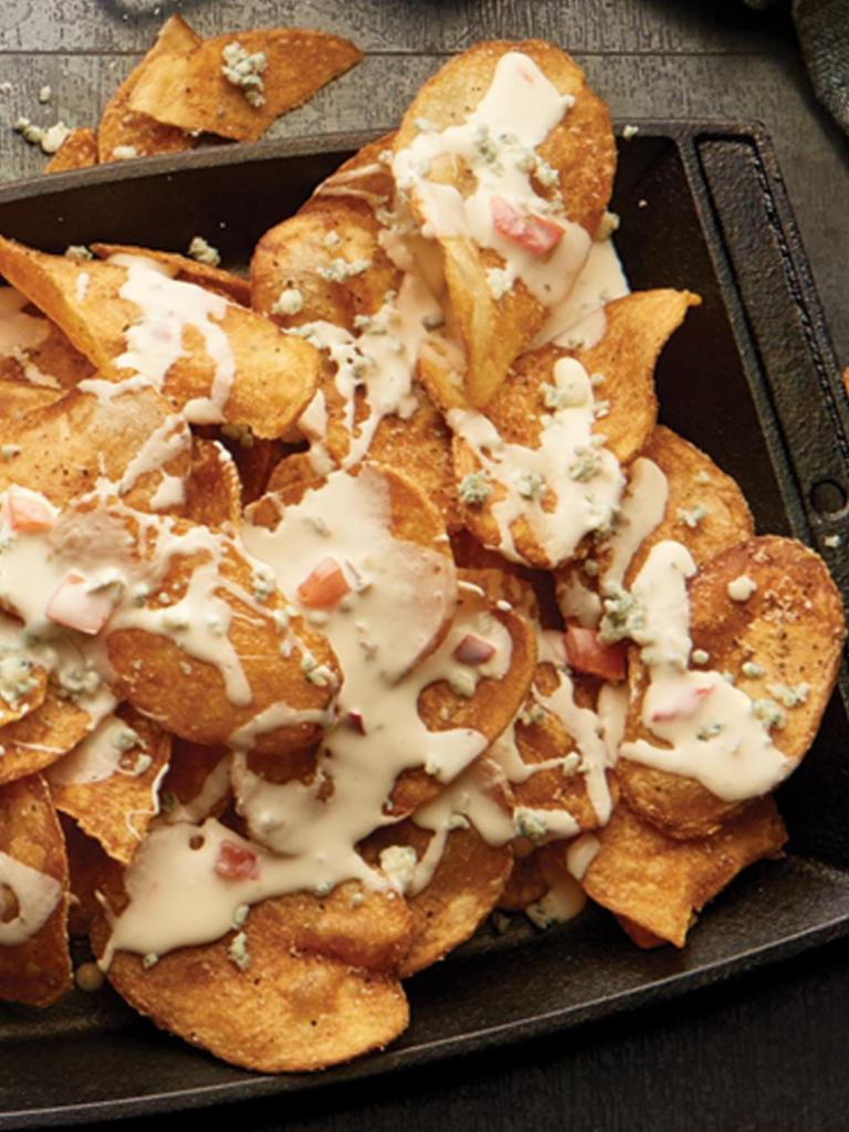 Bleu ＆ White Chips · House-made potato chips with bleu cheese crumbles, green onion, and white cheese sauce.