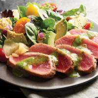 Seared Tuna Salad · Savory mixed greens, rare ahi tuna, grape tomatoes, avocado, sesame seeds, and cilantro-lime...