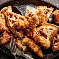 Chicken ＆ Waffles · House-made Belgian waffles served with hand-battered chicken tenders and maple syrup
